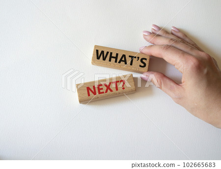 What is next symbol. Concept words What is next on wooden blocks. Beautiful white background. Businessman hand. Business and What is next concept. Copy space. What is next symbol. Concept words What is next on wooden blocks. Beautiful white background. Businessman hand. Business and What is next concept. Copy space. 102665683