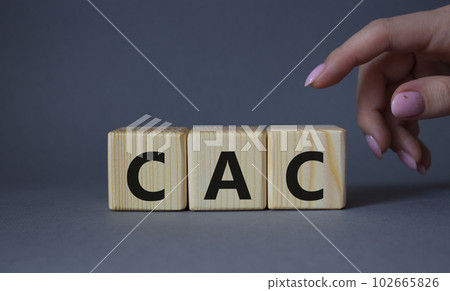 CAC - Customer Acquisition Cost symbol. Wooden cubes with word CAC. Beautiful grey background. Businessman hand. Business and Customer Acquisition Cost concept. Copy space. CAC - Customer Acquisition Cost symbol. Wooden cubes with word CAC. Beautiful grey background. Businessman hand. Business and Customer Acquisition Cost concept. Copy space. 102665826