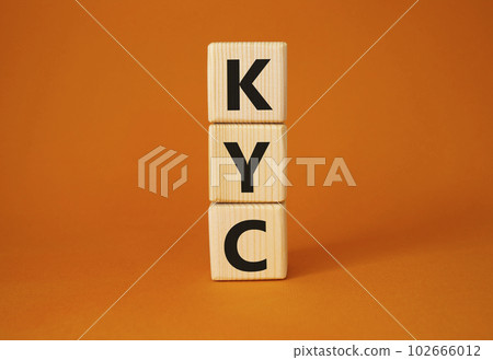 KYC - Know Your Customer. Wooden cubes with word KYC. Beautiful orange background. Business and Know Your Customer concept. Copy space. KYC - Know Your Customer. Wooden cubes with word KYC. Beautiful orange background. Business and Know Your Customer concept. Copy space. 102666012