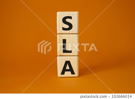 SLA - Service Level Agreement. Wooden cubes with word SLA. Beautiful orange background. Business and Service Level Agreement concept. Copy space. SLA - Service Level Agreement. Wooden cubes with word SLA. Beautiful orange background. Business and Service Level Agreement concept. Copy space. 102666014