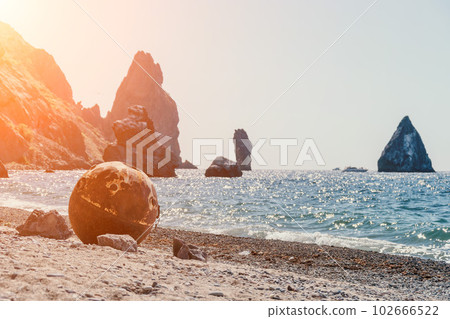 Old rusty sea mine on the beach. 102666522