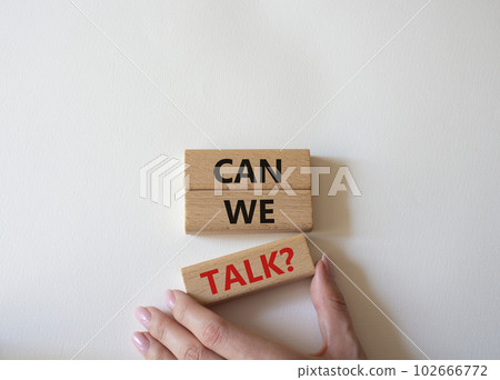 Can we talk symbol. Concept word Can we talk on wooden blocks. Businessman hand. Beautiful white background. Business and Can we talk concept. Copy space 102666772