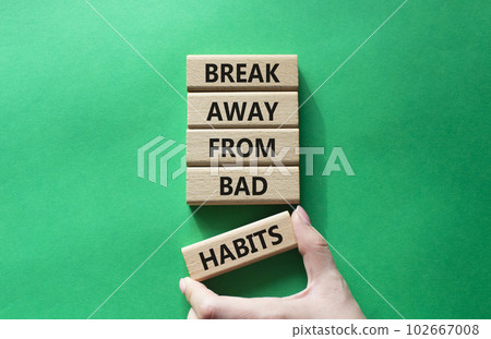 Break away from bad habits symbol. Wooden blocks with words Break away from bad habits. Beautiful green background. Businessman hand. Business and Break away from bad habits concept. Copy space. Break away from bad habits symbol. Wooden blocks with words Break away from bad habits. Beautiful green background. Businessman hand. Business and Break away from bad habits concept. Copy space. 102667008