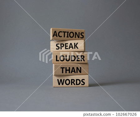 Actions speak louder than Words symbol. Wooden blocks with words Actions speak louder than Words. Beautiful grey background. Business and Actions concept. Copy space. 102667026