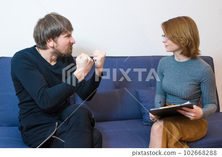 A man in a stressful condition at a consultation with a psychotherapist. Mental health 102668288