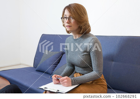 A young psychotherapist works in the office. Psychology, psychotherapy, mental health 102668291