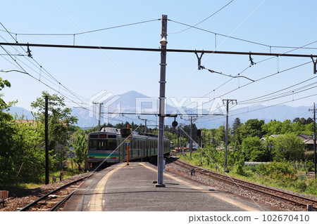 Chichibu Railway train running with Mt. Buko in the background, near Wado-Kurotani Station 102670410