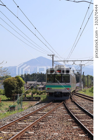 Chichibu Railway train running with Mt. Buko in the background, near Wado-Kurotani Station 102670444