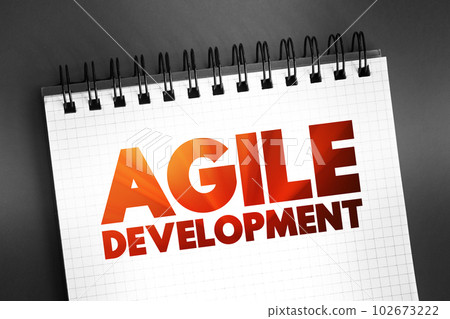 Agile Development - any development process that is aligned with the concepts of the agile manifesto, text concept on notepad 102673222