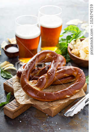 Freshly baked pretzels with beer Freshly baked pretzels with beer 102674559