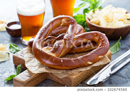 Freshly baked pretzels with beer Freshly baked pretzels with beer 102674560