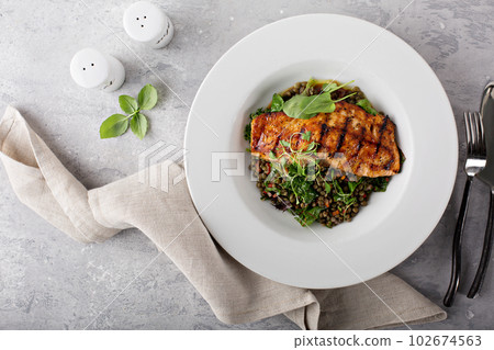 Grilled salmon with lentils and swiss chard Grilled salmon with lentils and swiss chard 102674563