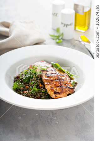 Grilled salmon with lentils and swiss chard Grilled salmon with lentils and swiss chard 102674565