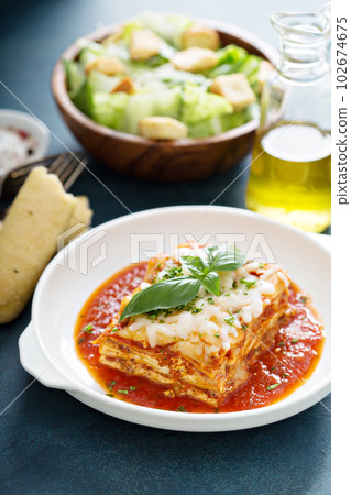 Traditional lasagna on white plate Traditional lasagna on white plate 102674675
