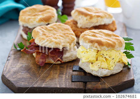 Breakfast biscuits with soft scrambled eggs and bacon Breakfast biscuits with soft scrambled eggs and bacon 102674681