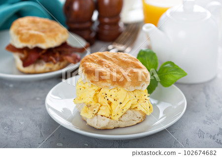 Breakfast biscuits with soft scrambled eggs and bacon 102674682