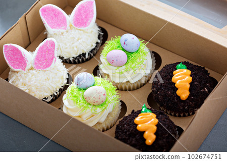 Assortment of easter cupcakes in a box 102674751