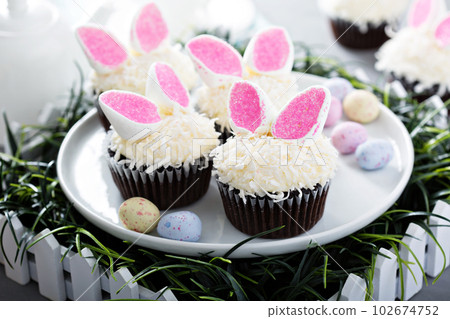 Easter chocolate cupcakes with bunny ears Easter chocolate cupcakes with bunny ears 102674752