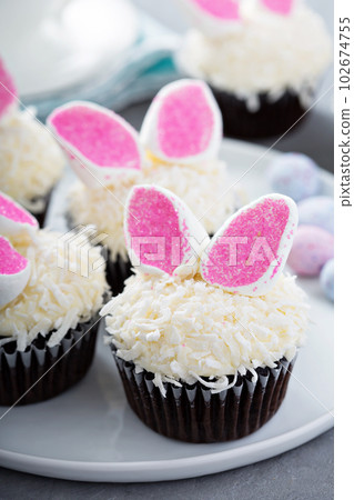 Easter chocolate cupcakes with bunny ears 102674755