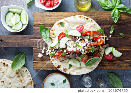 Flatbread with beef and vegetables 102674765