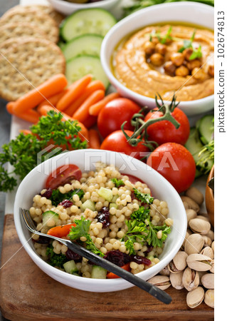 Pearl couscous salad with fresh vegetables 102674813