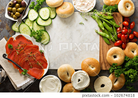 Big breakfast platter with bagels, smoked salmon and vegetables 102674818