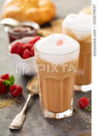 Hot coffee latte with raspberry syrup Hot coffee latte with raspberry syrup 102674937