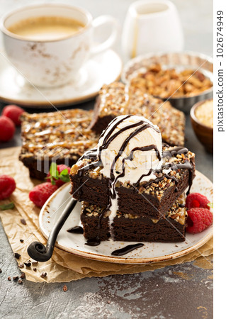 Fudgy brownies with nuts and caramel 102674949