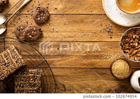 Fudgy brownies with nuts and caramel 102674954