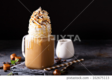 Caramel iced latte with whipped cream Caramel iced latte with whipped cream 102675113
