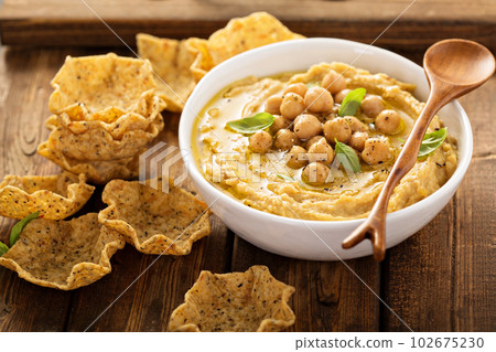 Homemade hummus with tortilla bowls Homemade hummus with tortilla bowls 102675230