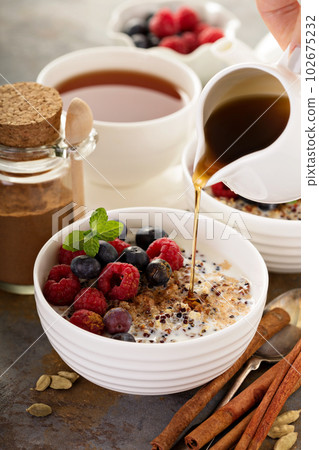 Quinoa porridge with raspberry and blueberry 102675232