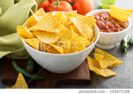 Corn tortilla chips in big bowl Corn tortilla chips in big bowl 102675286