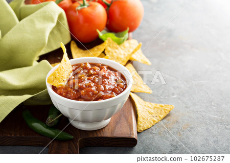 Red tomato spicy salsa with chips Red tomato spicy salsa with chips 102675287