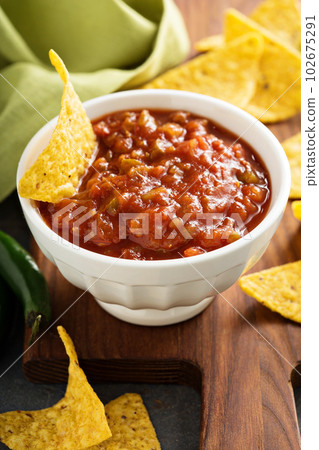 Red tomato spicy salsa with chips Red tomato spicy salsa with chips 102675291