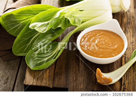 Baby bok choy with peanut sauce Baby bok choy with peanut sauce 102675368