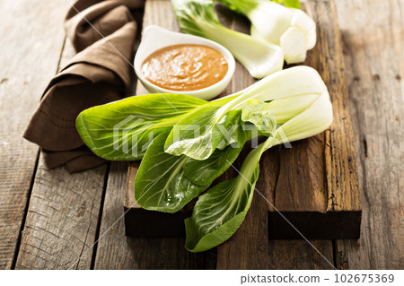 Baby bok choy with peanut sauce Baby bok choy with peanut sauce 102675369