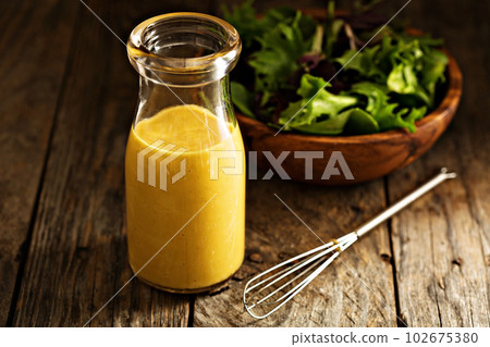 Homemade honey mustard dressing 102675380