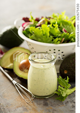 Avocado ranch dressing in small jar 102675430