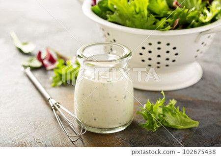 Homemade ranch dressing in a small jar 102675438