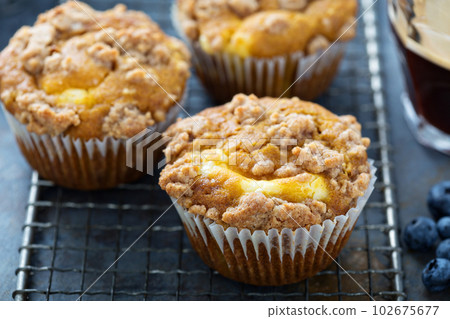 Pumpkin muffins with cheesecake filling 102675677