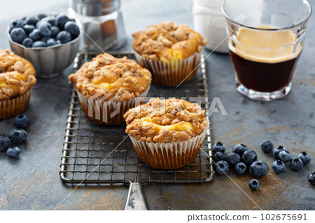 Pumpkin muffins with cheesecake filling 102675691