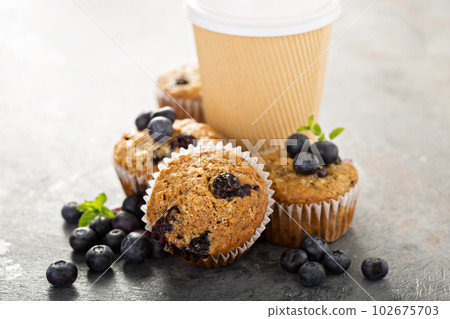 Vegan banana blueberry muffins with coffee to go 102675703