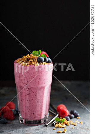 Berry smoothie in a tall glass 102675785