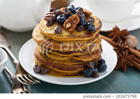 Pumpkin pancakes with blueberries Pumpkin pancakes with blueberries 102675798