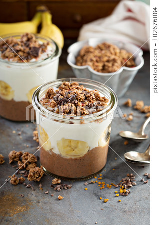 Chocolate chia pudding parfait with banana 102676084