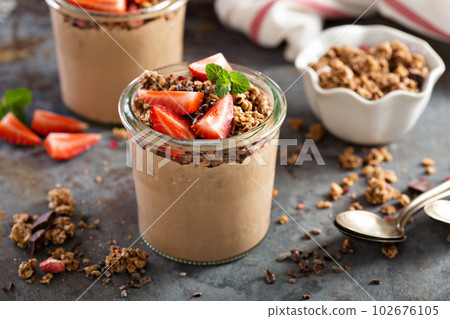 Healthy chocolate banana smoothie with granola 102676105