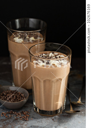 Chocolate banana smoothie with cocoa nibs Chocolate banana smoothie with cocoa nibs 102676169