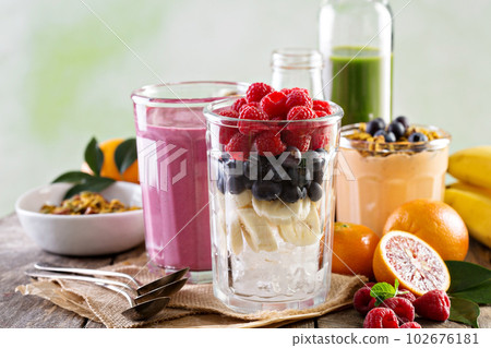 Berry smoothie ingredients in tall glass 102676181