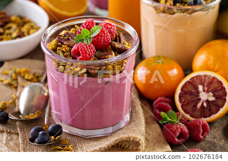 Healthy orange and raspberry smoothie 102676184